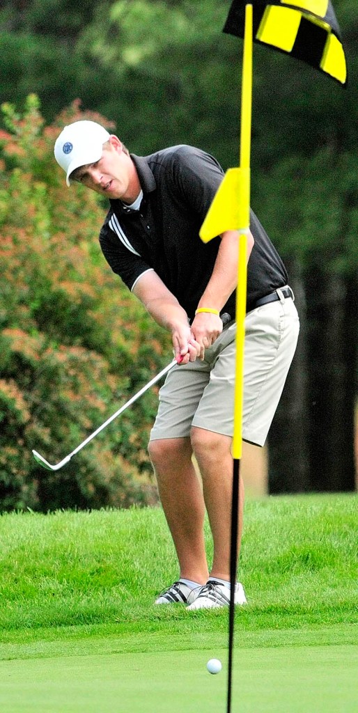 Staff photo by Joe Phelan Toby Spector putts on 12th green on the first day of the Charlie's Maine Open Championship on Tuesday at the Augusta Country Club in Augusta.