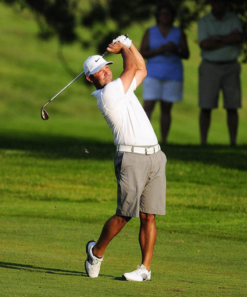 Staff photo by Joe Phelan Dustin Cone drives from fairway onto green during sudden death playoff on first hole to win the Charlie's Maine Open Championship on Wednesday at the Augusta Country Club in Augusta. Dustin Cone beat Jimmy Lytle after they tied with 137.