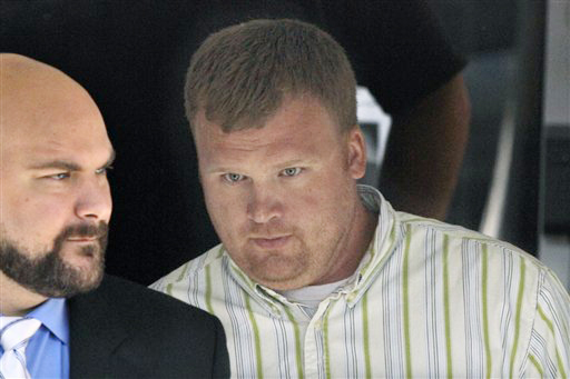 Matt Sandusky, adopted son of Jerry Sandusky, right, leaves the Centre County Courthouse in Bellefonte, Pa. Just a few hours into deliberations on Thursday, Matt Sandusky, came forward for the first time to say in a statement that his father had abused him. The statement didn't detail the abuse allegation.