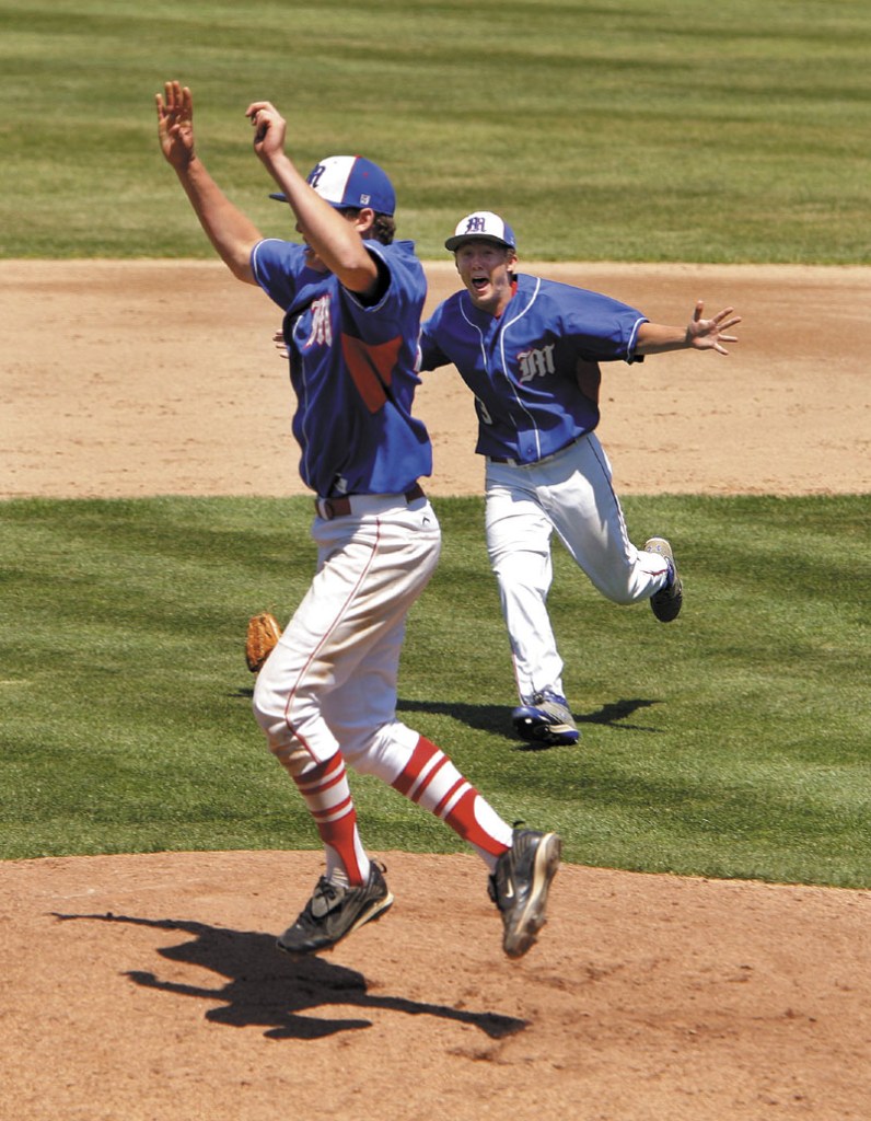 JUMP FOR JOY: Messalonskee’s Jacob Dexter, left, and Josh Woodard celebrate their victory over Scarborough in the Class A baseball state championship game Saturday at St. Joseph’s College in Standish.
