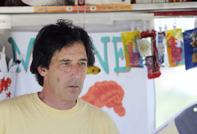 Carl Dittrich of Cape Elizabeth, above, who was operating his Atlantic Cookie Co. food cart at the park, said at first he thought he was watching a stunt for a movie because he saw a helicopter simultaneously approach from Portland Harbor. “Then the plane hit the water,” Dittrich said.