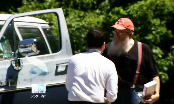This screen image from a WGME-TV news segment shows reporter Steve Roldan, left, with David Houston of Bridgton.
