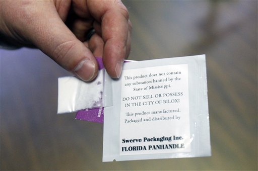 In this Friday, Jan. 29, 2011, file photo, packages of fake "bath salts," synthetic stimulants that mimic the effects of traditional drugs like cocaine and speed, are displayed by Senate Drug Policy Committee chairman Sid Albritton, R-Picayune, at the Capitol in Jackson, Miss. On July 10, 2012, President Obama signed a law banning more than two dozen of the most common chemicals used to make the drugs. Over the past two years health care and law enforcement professionals have seen a surge in use of the drugs, often sold under the guise of bath salts, incense and plant food. (AP Photo/Rogelio V. Solis, File)