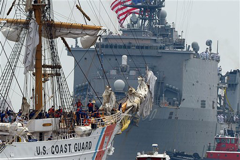 The Unites States Coast Guard Barque Eagle passes the U.S.S. Carter Hall after the Eagle turned around during the parade of sail on the Thames River on Saturday July 7, 2012 in New London, Conn. The Eagle is visiting Portland, ME on Friday, July 27, 2012.