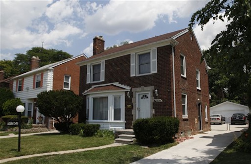 The exterior of Detroit police officer Isaac Parrish's home is shown in Detroit, Monday, July 9, 2012. Adaisha Miller was fatally shot early Sunday morning at the home of off-duty Detroit police officer Isaac Parrish. Police officials say Parrish's department-issued handgun accidentally fired while Miller was dancing behind him with her hands on his waist. The gun was in a holster on his waist. Parrish has been assigned to desk duty while the shooting is being investigated. (AP Photo/Paul Sancya)