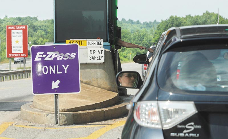 Motorists pass through the northbound lane of I-295 enter the Gardiner toll station on Monday.
