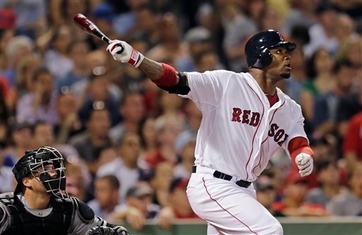 Boston Red Sox's Carl Crawford watches the flight of a fly out to center during a game against the Chicago White Sox at Fenway Park on Monday.