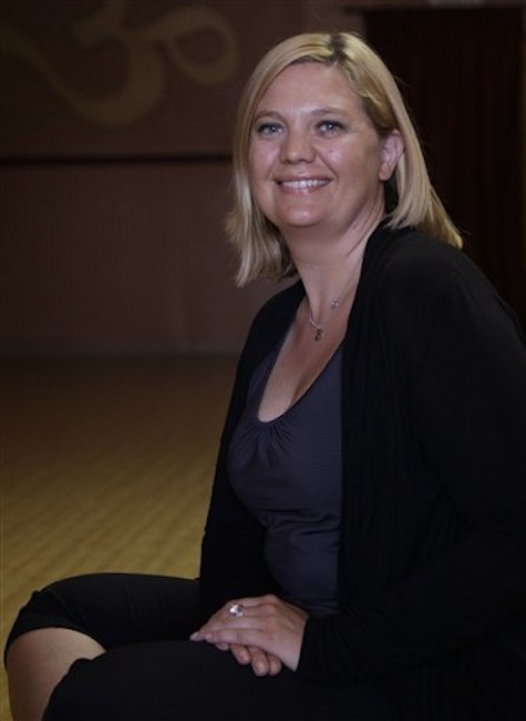 Yoga instructor Alice Van Ness is seen Wednesday, July 11, 2012, at Lifestretch Yoga in Milpitas, Calif. Van Ness has been fired for her disapproving stink-eye glare at a Facebook employee using a cellphone in class. (AP Photo/Ben Margot)