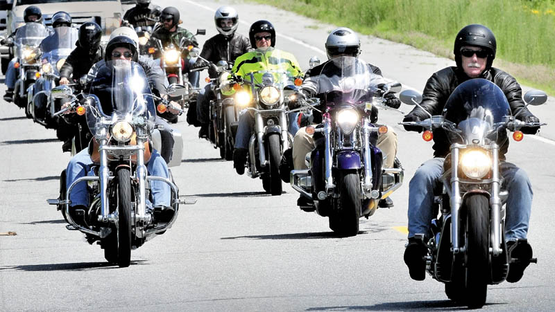 Angus King, former Maine governor and candidate for U.S. Senate, right, leads a group of motorcyclists after a campaign tour stop in Skowhegan on Wednesday.
