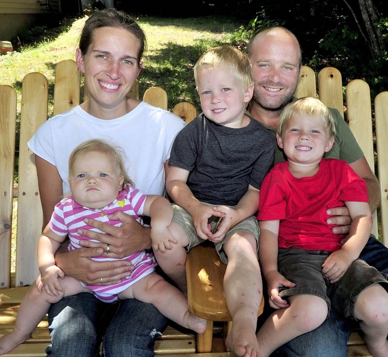 Stephanie and Chris Miller sit with their children, from left, Samantha, Kaleb and Tyce. The Miller family plan to enroll their children in the recently approved Cornville Regional Charter School. There is an open house and student registration from 6 to 8 p.m. Thursday at the former Cornville Elementary School.