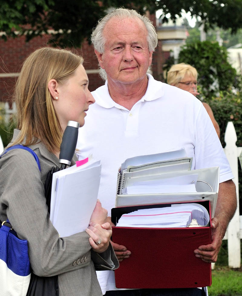 Landlord Halsey McDonough of Gardiner and his attorney Madeline Malisa speak on Tuesday in Skowhegan after a jury found McDonough not responsible for injuries to tenants caused by conditions in his Solon apartment building.