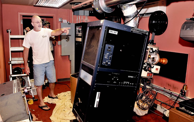 Head projectionist Rick Harmon helps install permanent projectors inside the Waterville Opera House on Thursday that will be used for the Maine International Film Festival.