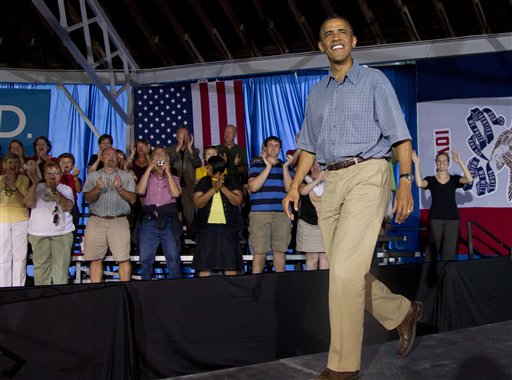 President Barack Obama arrives to speak during a campaign event at Herman Park, Monday, Aug. 13, 2012, in Boone, Iowa, during a three day campaign bus tour through Iowa. (AP Photo/Carolyn Kaster)