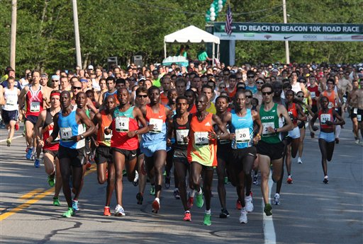 Runners leave the start line Saturday, Aug. 4, 2012, during the annual TD Bank Beach To Beacon 10K road race in Cape Elizabeth, Maine. (AP Photo/Joel Page)