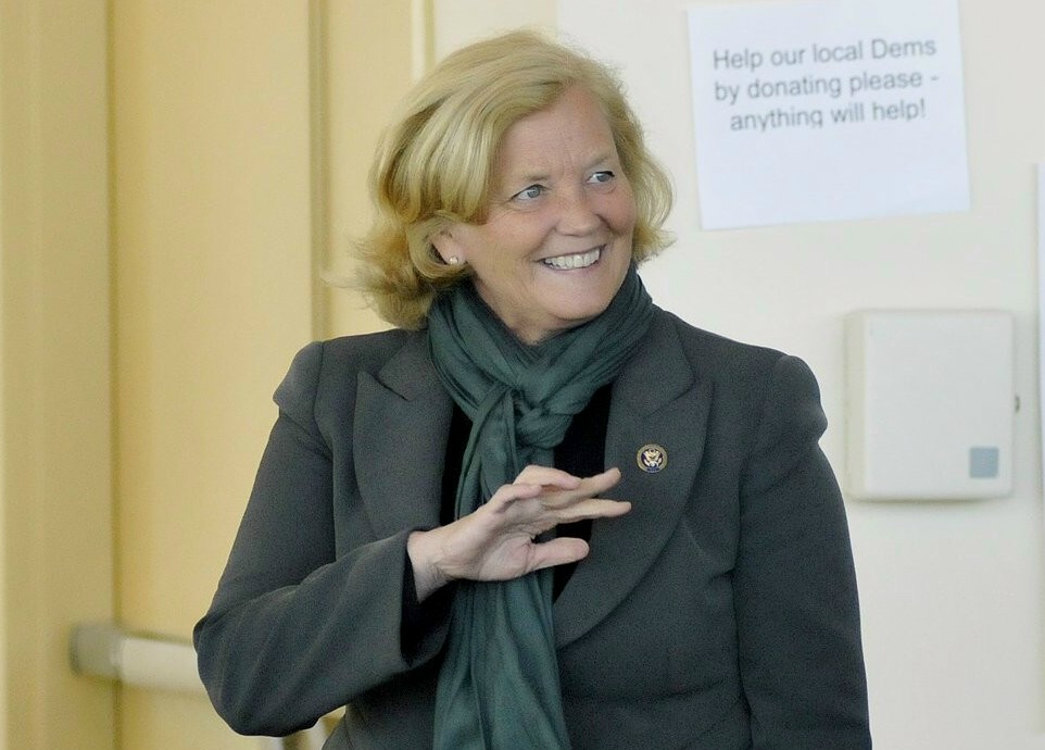 Staff Photo by Shawn Patrick Ouellette: Congresswoman Chellie Pingree waves as she is introduced to speak during the Portland Democratic Caucus Sunday, Feb. 26, 2012. To her left is a cut out of president Barack Obama.