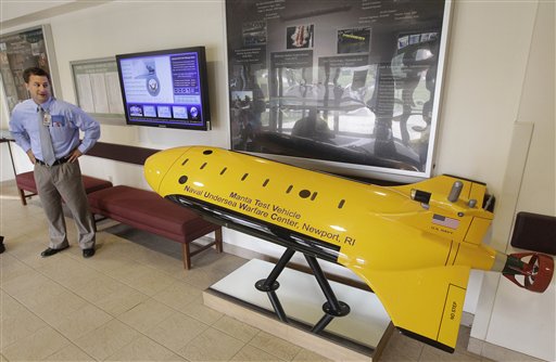 Christopher Del Mastro, head of anti submarine warfare mobil targets at the Naval Undersea War Center, stands next to a mockup of their Manta Test Vehicle in Middletown, RI., recently. Narragansett Bay is the testing ground for the Naval Undersea Warfare Center where the Navy is working toward its goal of achieving a squadron of self-driven, undersea vehicles.