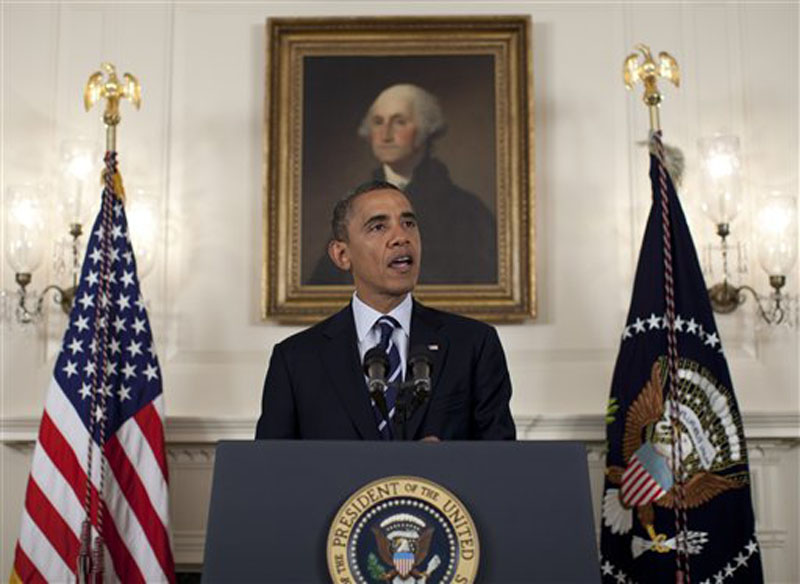 In this photo taken Aug. 28, 2012, President Barack Obama speaks about Tropical Storm Isaac, in the Diplomatic Room of the White House in Washington. Trying to keep his job as he does his job, President Barack Obama assures the nation his administration is on top of the looming Gulf Coast hurricane Isaac, then gets on a waiting helicopter to head out for votes. The swift pivot illustrates the presidentís juggle of governing and campaigning -- neither of which ever stops. (AP Photo/Carolyn Kaster)