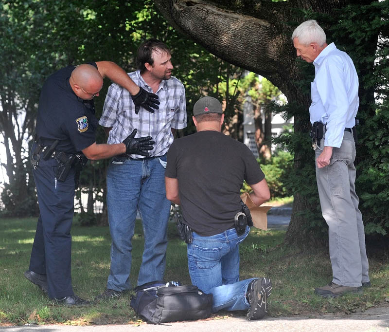 Waterville Police and Maine State Police apprehend two suspects on Pleasant Street in Waterville in connection to a Rite Aid robbery this morning.