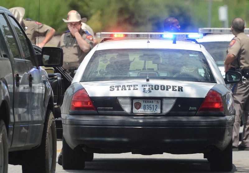 Law enforcement officers from across Brazos county congregate at the site of a shooting of two lawmen in College Station in a nieghborhood near Texas A&M University Monday. (Photo by Dave McDermand/Bryan-College Station Eagle)