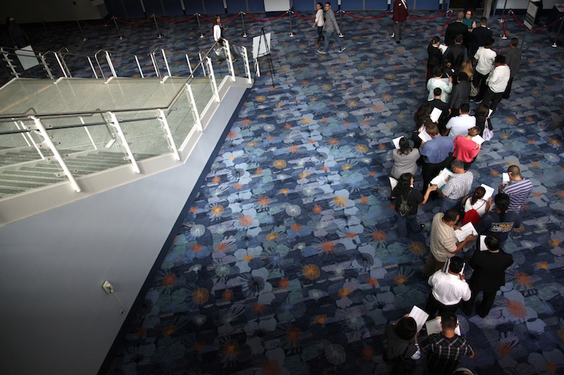 In this June 13, 2012 file photo, job seekers wait in line at a job fair expo in Anaheim, Calif. U.S. employers posted the most job openings in four years in June, a positive sign that hiring may pick up. The increase comes after employers added the most jobs in five months in July. (AP Photo/Jae C. Hong, File)