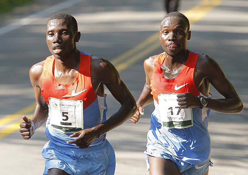 Beach to Beacon winner Stanley Biwott (5) pulls away from Stephen Kipkosgei during Saturday morning's race.