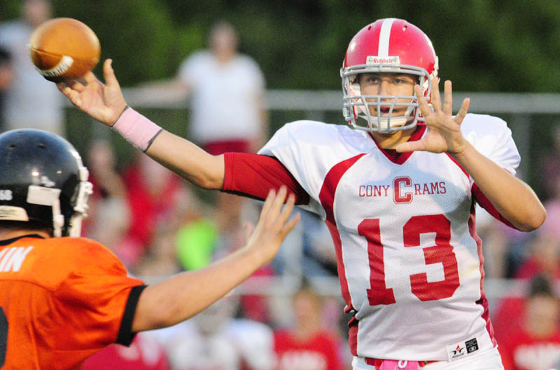It’s football season: Cony quarterback Ben Lucas throws a pass during against Gardiner during the 135th game between rival Cony and Gardiner on Friday night at Hoch Field in Gardiner.