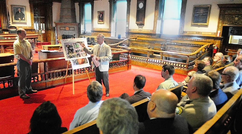 Chris Brown, project manager for Consigli, left, and Justice Thomas Humphrey, Chief Justice of the Superior Court, talk about plans for the new court house construction during a meeting in Kennebec County Superior Court in Augusta on Thursday afternoon.