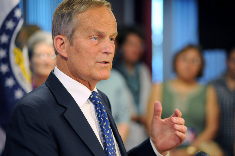 U.S. Rep. Todd Akin, R-Mo., addresses members of the media Friday in Chesterfield, Mo., where he confirmed his plans to remain in Missouri's U.S. Senate race despite a political uproar over remarks he made about rape and pregnancy.