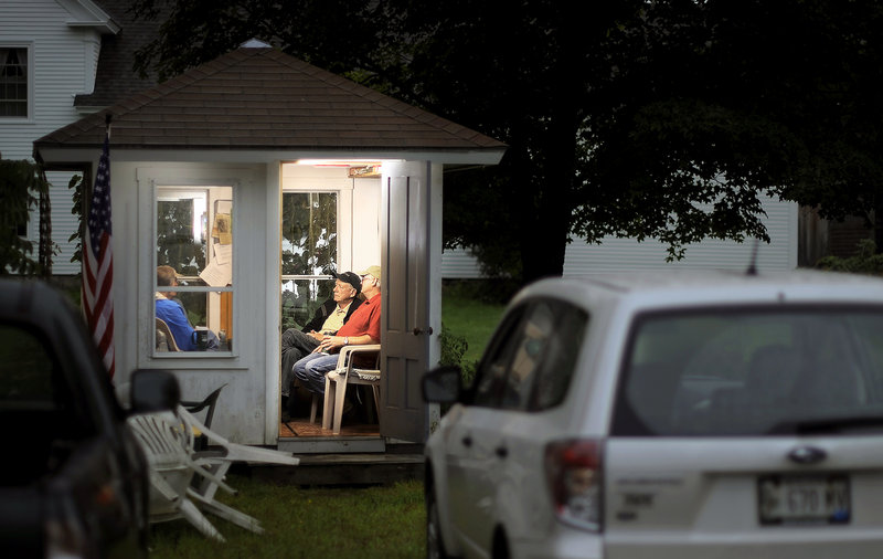 Members of the North Pownal Think Tank gather in their 8-by-8-foot headquarters.