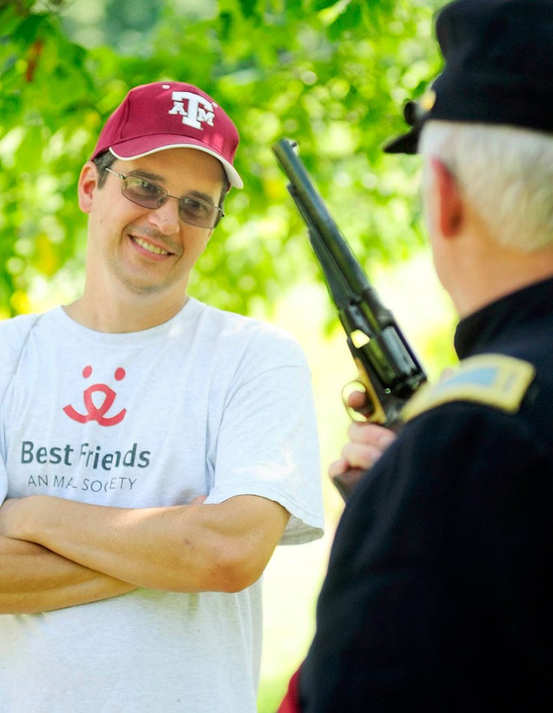 Mike Smith, of Gardiner, left, chats with Civil War reenactor Paul Dudley about pistols during an event on Saturday afternoon at Viles Arboretum in Augusta.