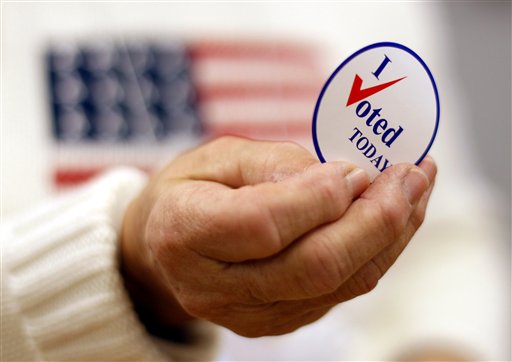 FILE - This Nov. 2, 2010 file photo shows a sticker handed out to a voter on Election Day, in Waterville, Maine. Here's something most politicians can click the like button for: Facebook friends played a big role in getting hundreds of thousands of people to vote in 2010 who probably would have otherwise stayed home, a new scientific study claims. It provides scientific evidence showing the real world political power of social media. (AP Photo/Robert F. Bukaty, File)