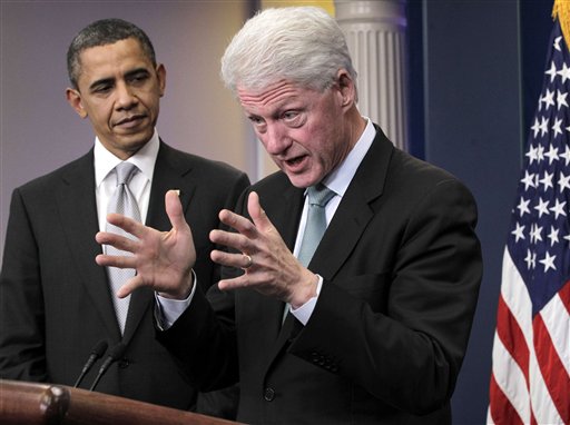 FILE -In this Dec. 10, 2010 file photo, President Barack Obama listens as former President Bill Clinton speaks in the briefing room of the White House in Washington. When Bill Clinton takes the convention stage to endorse Barack Obama later this week, it will be a landmark step on a path to reconciliation for two former rivals whose political fortunes are now inextricably tied. By embracing Clinton, Obama hopes to capture the former president's uncanny knack for political survival against tough odds. And it doesn�t hurt that the economy and the nation�s budget picture last truly soared under Clinton. (AP Photo/J. Scott Applewhite, File)