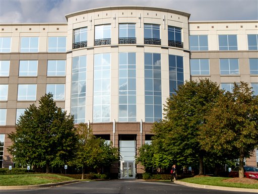 A person leaves a building that houses Republican presidential candidate Mitt Romney's accounting firm in Franklin, Tenn., Wednesday, Sept. 5, 2012. The Secret Service says is investigating the reported theft of copies Romney's federal tax records during a break-in at PricewaterhouseCoopers. The company said there was no evidence that any Romney tax files were stolen. (AP Photo/Erik Schelzig)