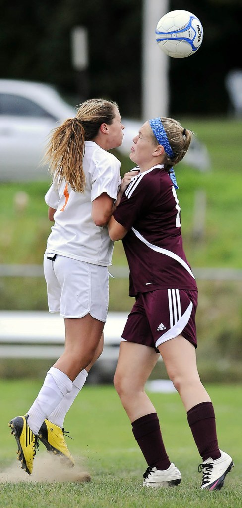 Heads up: Gardiner’s Morgan Carver, left, and Nokomis’ Sara Packard go up for the ball Tuesday in Gardiner.