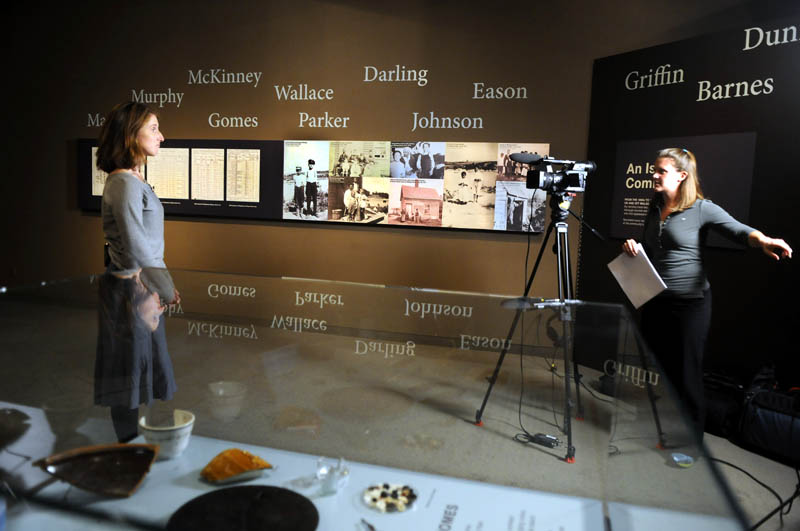 C-SPAN video journalist Adrienne Hoar, right, interviews Maine State Museum Curator of Historic Collections Kate McBrien on Monday in the exhibition "Malaga Island, Fragmented Lives." The network is visiting various historic and literary sites and interviewing local historians, authors and state officials, with the resulting productions to be broadcast on two cable TV channels next month.