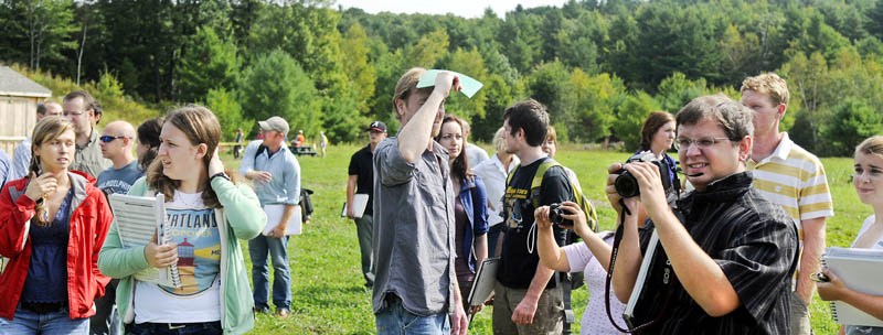 University of Maine at Augusta architecture students examine the terrain Thursday for a proposed lodge at the Bond Brook Recreation Area in Augusta. The students toured the trails and site of the proposed hut for skiers, hikers and bikers to come up with a design proposal.