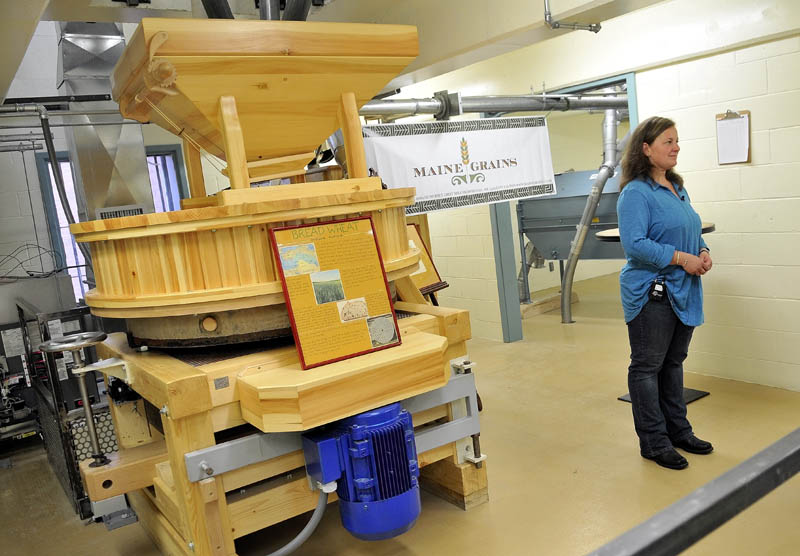 Amber Lambke, President of the Somerset Grist Mill, gives an interview during the grand opening Somerset Grist Mill on Wednesday in the old jail house in Skowhegan.