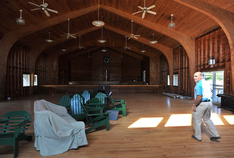 Staff photo by Michael G. Seamans John Wiggin, director of the New England Music Camp walks through Alumni Hall which is currently under renovations on Friday. Alumni Hall is part of a larger planned renovation at the camp that also includes construction of a physical plant and performance space.