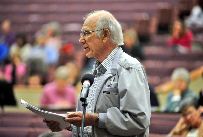 Staff photo by Michael G. Seamans Peter McKenney, a former teacher at Messalonskee High School speaks his thoughts to those assmebled for the RSU 18 district budget meeting at Messalonskee High School for the current school year on Thursday.