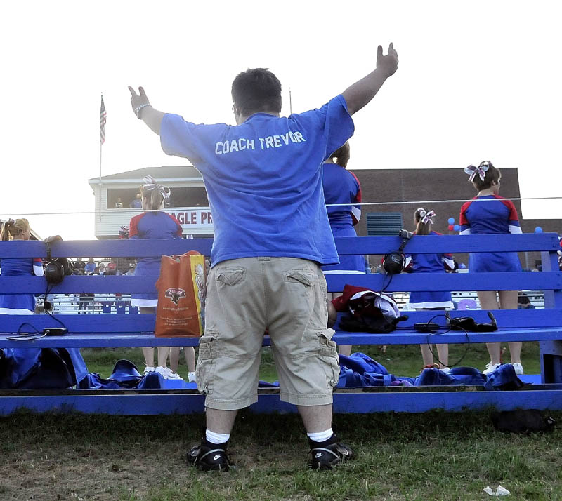 Trevor Perry pumps up the home crowd at Messalonskee High School in Oakland Friday night.