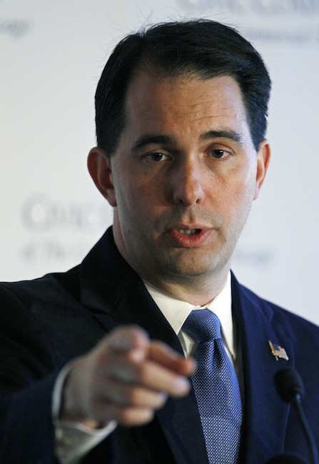 In this June 25, 2012 file photo, Wisconsin Gov. Scott Walker speaks at a news conference in Chicago. A Wisconsin judge strikes down Gov. Walker's law ending most collective bargaining for public workers. Dane County Circuit Judge Juan Colas ruled Friday, Sept. 14, 2012, that the law violates both the state and U.S. Constitution and is null and void. (AP Photo/Charles Rex Arbogast, File)