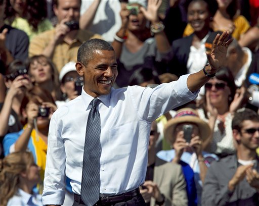 In this Sept. 13, 2012, photo, President Barack Obama waves after speaking at a campaign rally in Golden, Colo. Obama and Republican Mitt Romney are embarking on a week heavy with travel through battleground states and appeals key constituencies, with both campaigns wrangling over unrest in the Middle East and who is best equipped to rejuvenate the economy. Both candidates are courting voters in a series of must-win states and reaching out to a number of voting groups that could determine the election, from working-class white voters in states like Ohio and Wisconsin to Latino voters in Florida and viewers of a popular Spanish-language television network. (AP Photo/Ed Andrieski)