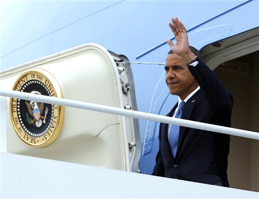 President Barack Obama waves as he arrives on Air Force One at John F. Kennedy International Airport, Tuesday, Sept. 18, 2012, in New York. (AP Photo/Carolyn Kaster)