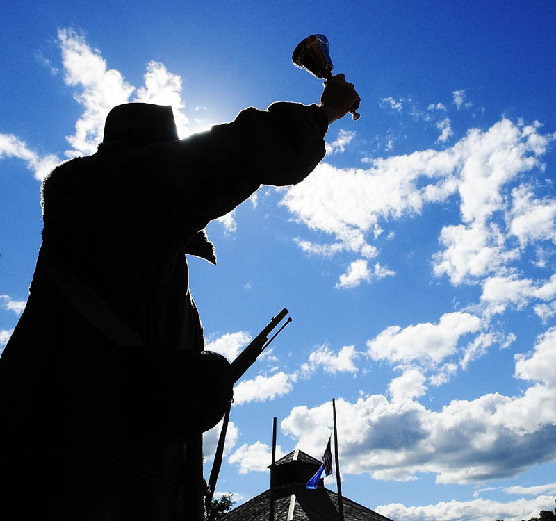 Town crier Pete Morrissey rings a bell and announces that Daughters of the American Revolution member Bonnie Wilder will be doing her "Meet the 1787 Framers" program on Saturday afternoon at Old Fort Western in Augusta. It was part of the celebration for 225th anniversary of the US Constitution.