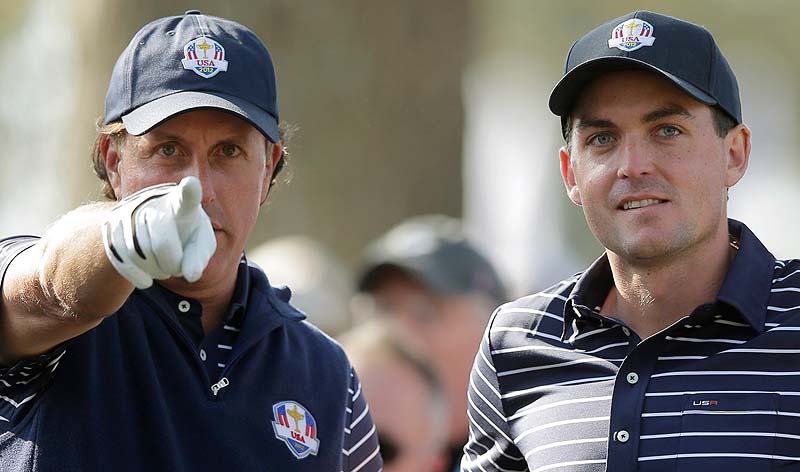 Phil Mickelson talks to Keegan Bradley on the 12th tee during a foursomes match at the Ryder Cup Saturday at the Medinah Country Club in Medinah, Ill.