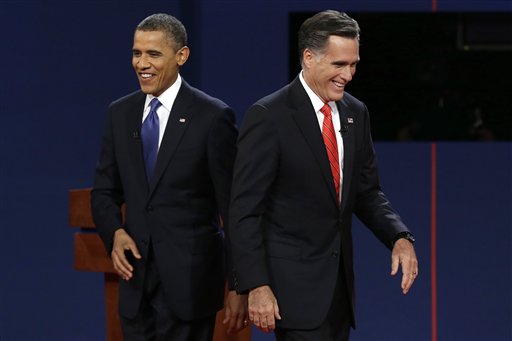 President Barack Obama walks past Republican presidential nominee Mitt Romney during the first presidential debate at the University of Denver, Wednesday, Oct. 3, 2012, in Denver. (AP Photo/Charlie Neibergall)