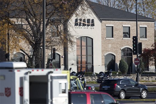 Emergency vehicles surround the Azana Salon, the scene of a shooting in Brookfield, Wis. on Sunday. Police identified the shooting suspect as Radcliffe Franklin Haughton, 45, of Brown Deer, Wis. Three people were killed and four others wounded.