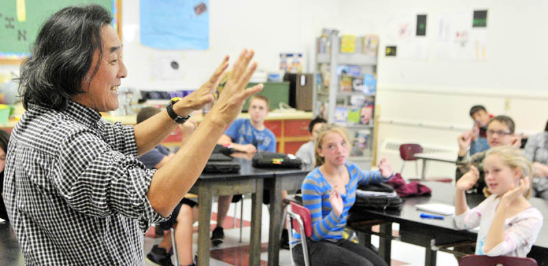 Naoto Kobayashi teaches a Japanese language class on Thursday afternoon at Richmond Middle School.