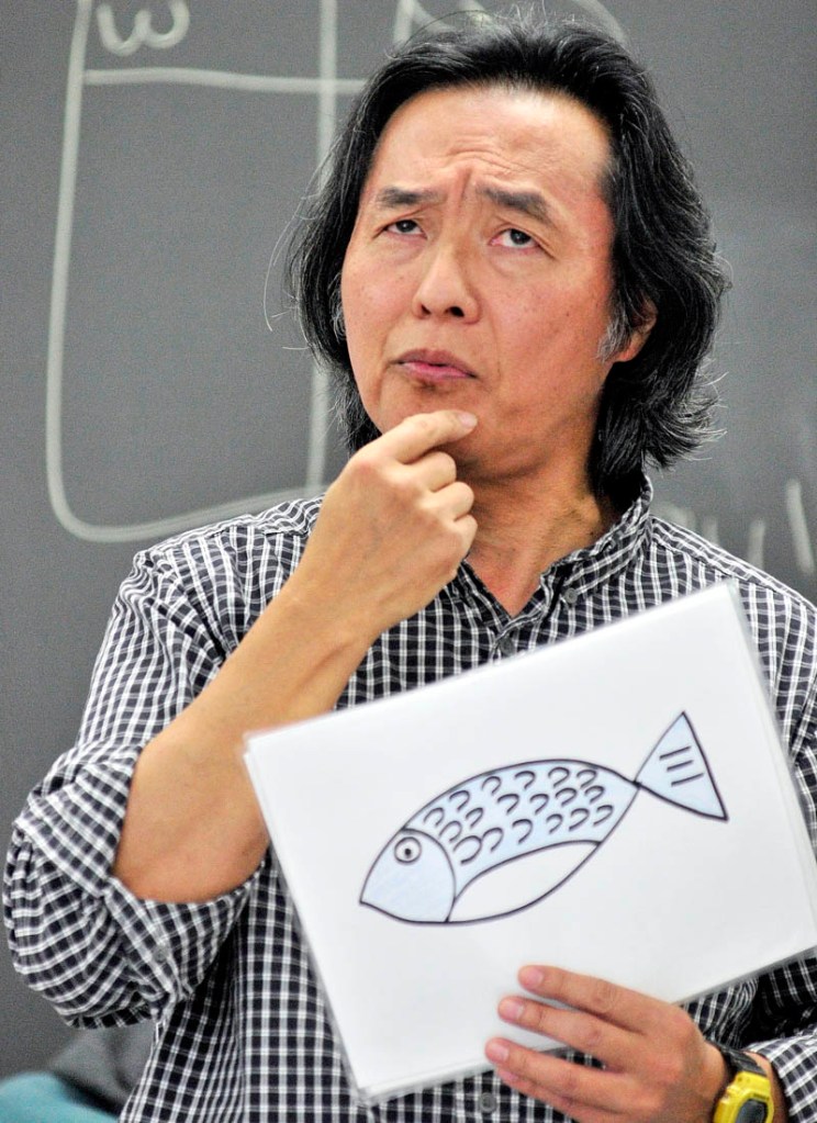 Naoto Kobayashi teaches a Japanese language class on Thursday afternoon at Richmond Middle School.