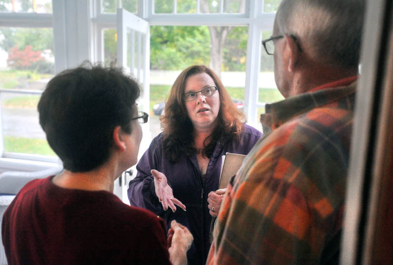 Staff photo by Michael G. Seamans Colleen Lachowicz, Democratic candidate a seat in the Maine State senate, center, speaks with Douglas Archibald, right, and Debra Campbell,left, at 43 Burleigh St in Waterville Thursday. Lachowicz is running for the seat in a Senate district encompassing part of Waterville, Winslow, Albion, Benton, Clinton, Detroit, Pittsfield and Unity Township.